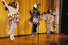 students dance in quail costume